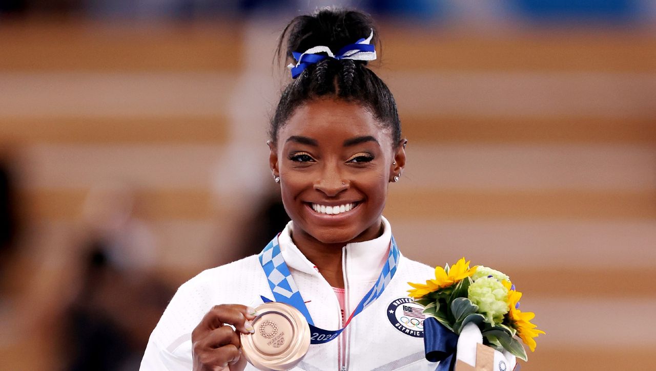 How many medals did Simone Biles win as she returns home Woman & Home