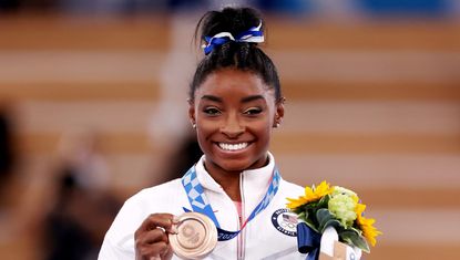 Simone Biles of Team United States poses with the bronze medal during the Women's Balance Beam Final medal ceremony on day eleven of the Tokyo 2020 Olympic Games at Ariake Gymnastics Centre on August 03, 2021 in Tokyo, Japan.