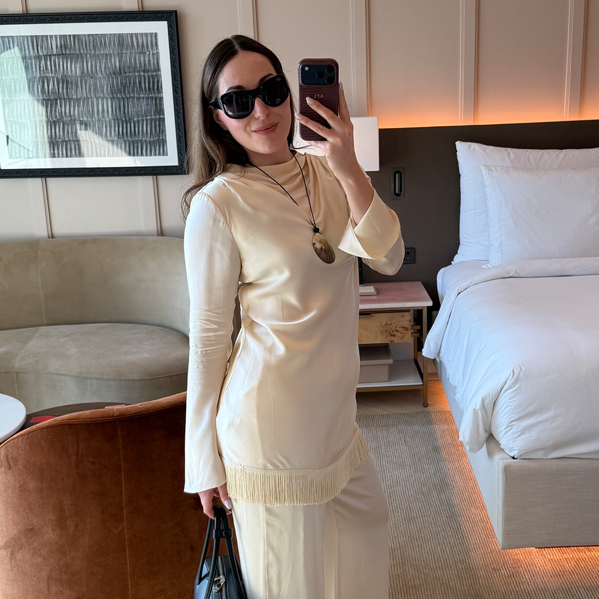 Who What Wear senior fashion editor Anna LaPlaca wearing a Doen silk fringe dress and pants