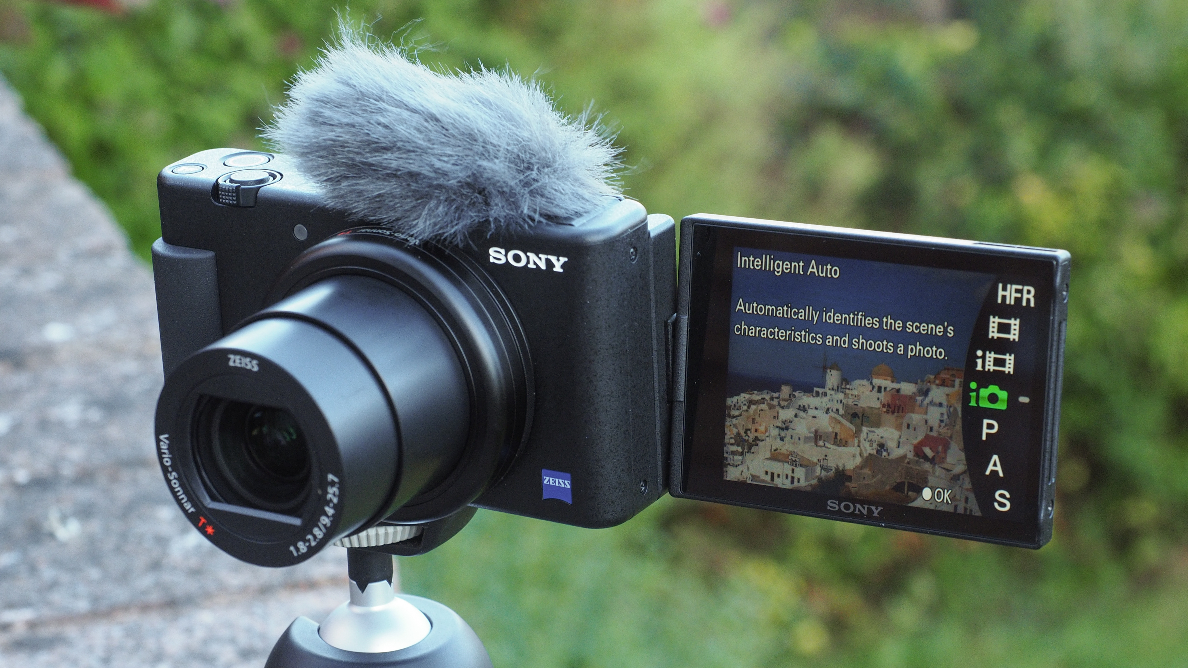 Sony ZV-1 compact camera on a tripod outdoors