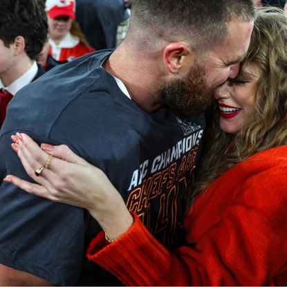 Travis Kelce #87 of the Kansas City Chiefs (L) celebrates with Taylor Swift after defeating the Baltimore Ravens in the AFC Championship Game at M&T Bank Stadium on January 28, 2024 in Baltimore, Maryland.