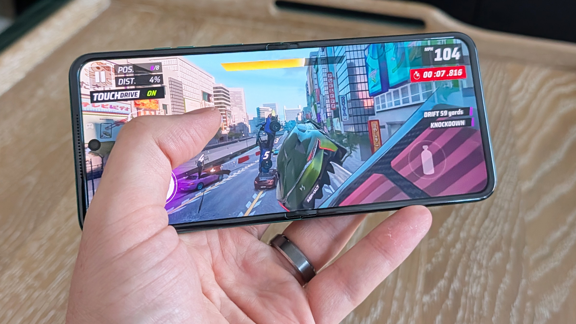 Motorola Razr 2026 in blue, being held in the hand