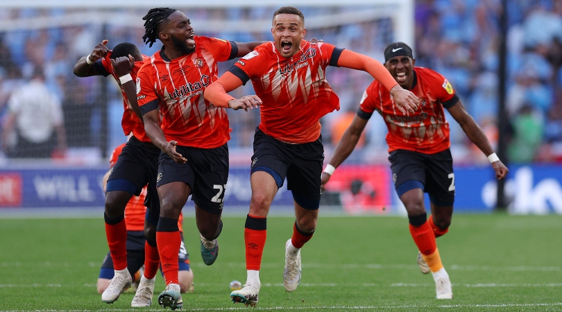 Luton players celebrate after beating Coventry on penalties at Wembley in the Championship play-off final in May 2023.