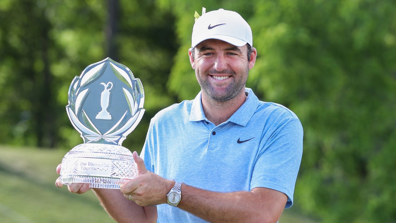 Scottie Scheffler poses with the Memorial Tournament trophy