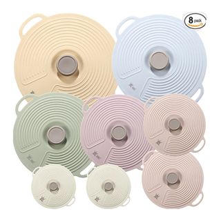A set of pastel colored food storage covers
