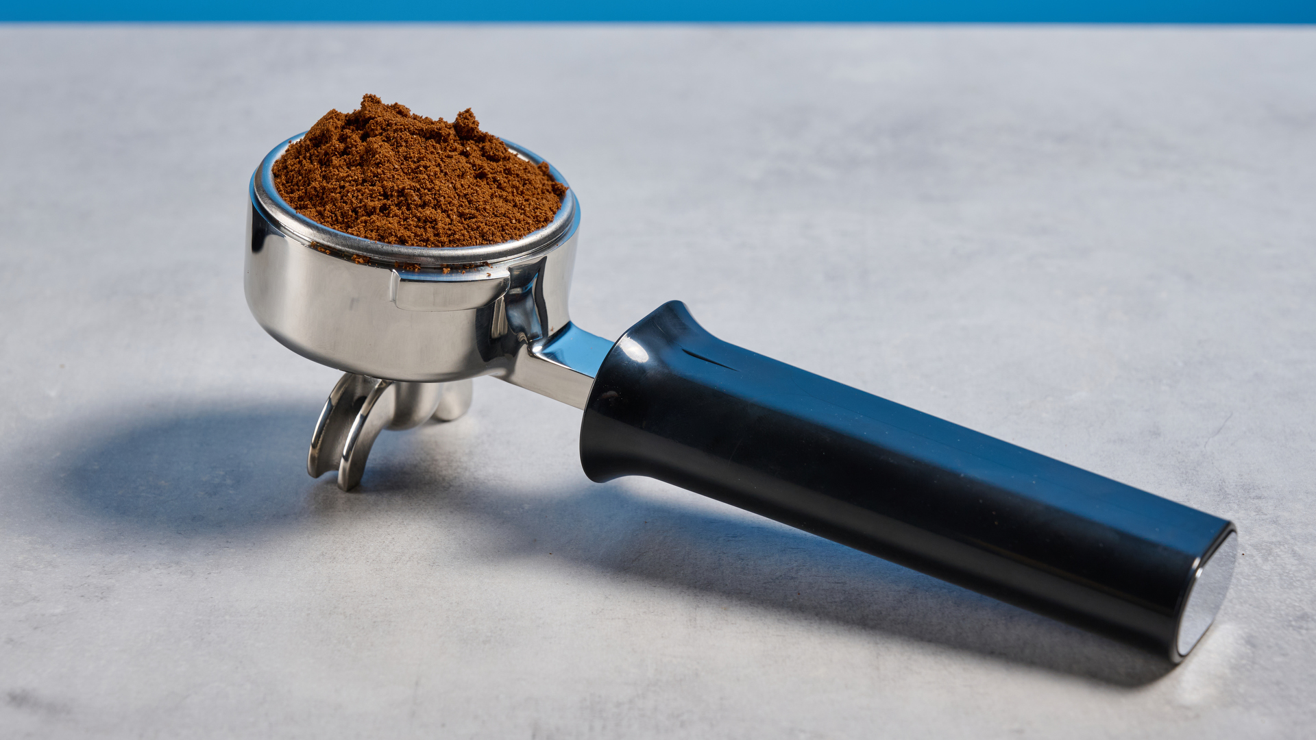 The Gaggia Classic E24 Evo Pro portafilter with coffee grounds in it