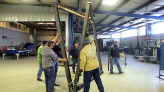 Group of men lifting the unique space truss geometry - QuaDror