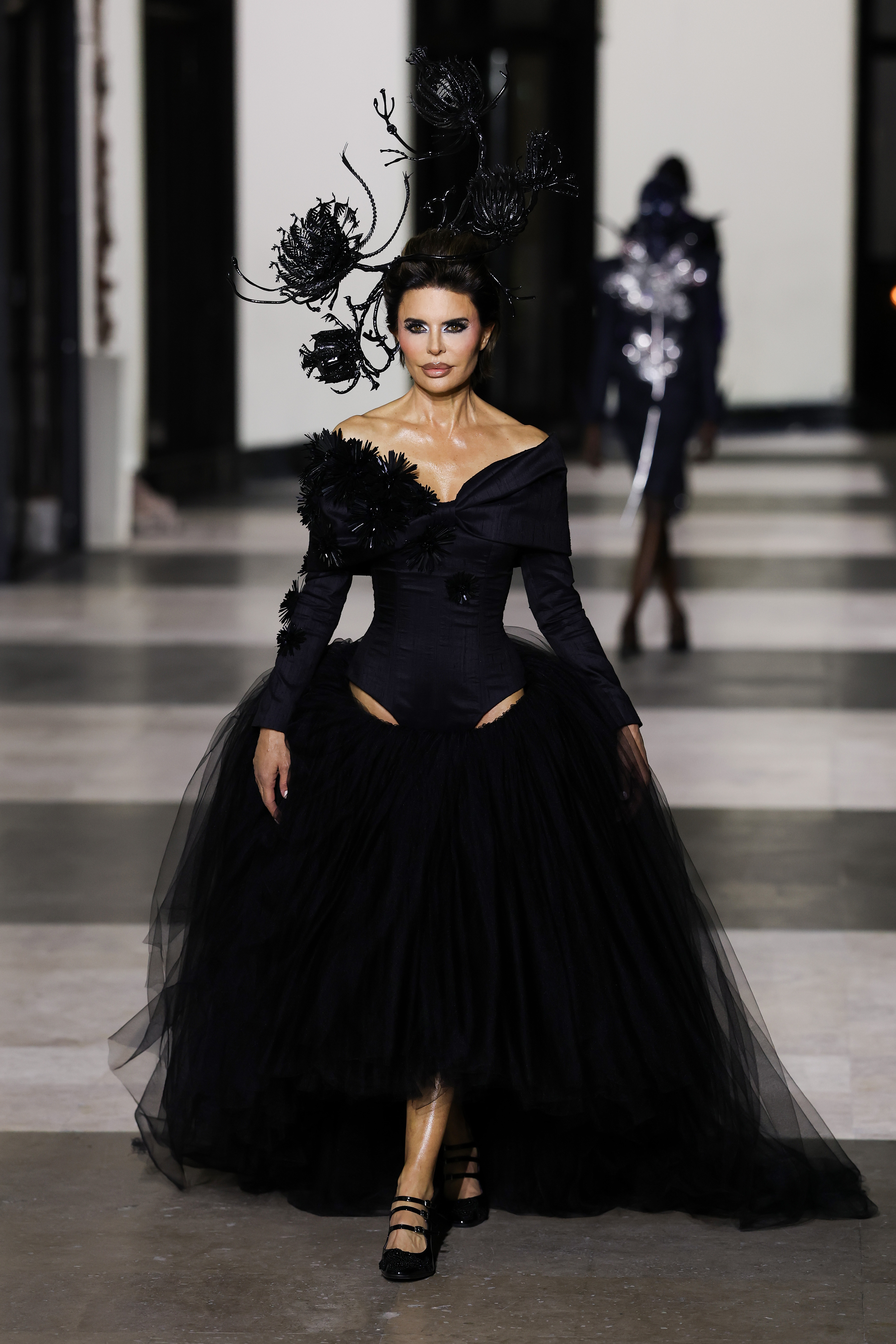 Lisa Rinna made her Haute Couture Week runway debut in a dramatic black tulle gown in Germainer's show