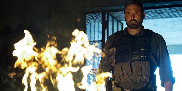 Triple Frontier Ben Affleck intensely stares into a burning pile of money