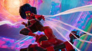 A pregnant Jessica Drew fires some webbing from her motorbike in Spider-Man: Across the Spider-Verse
