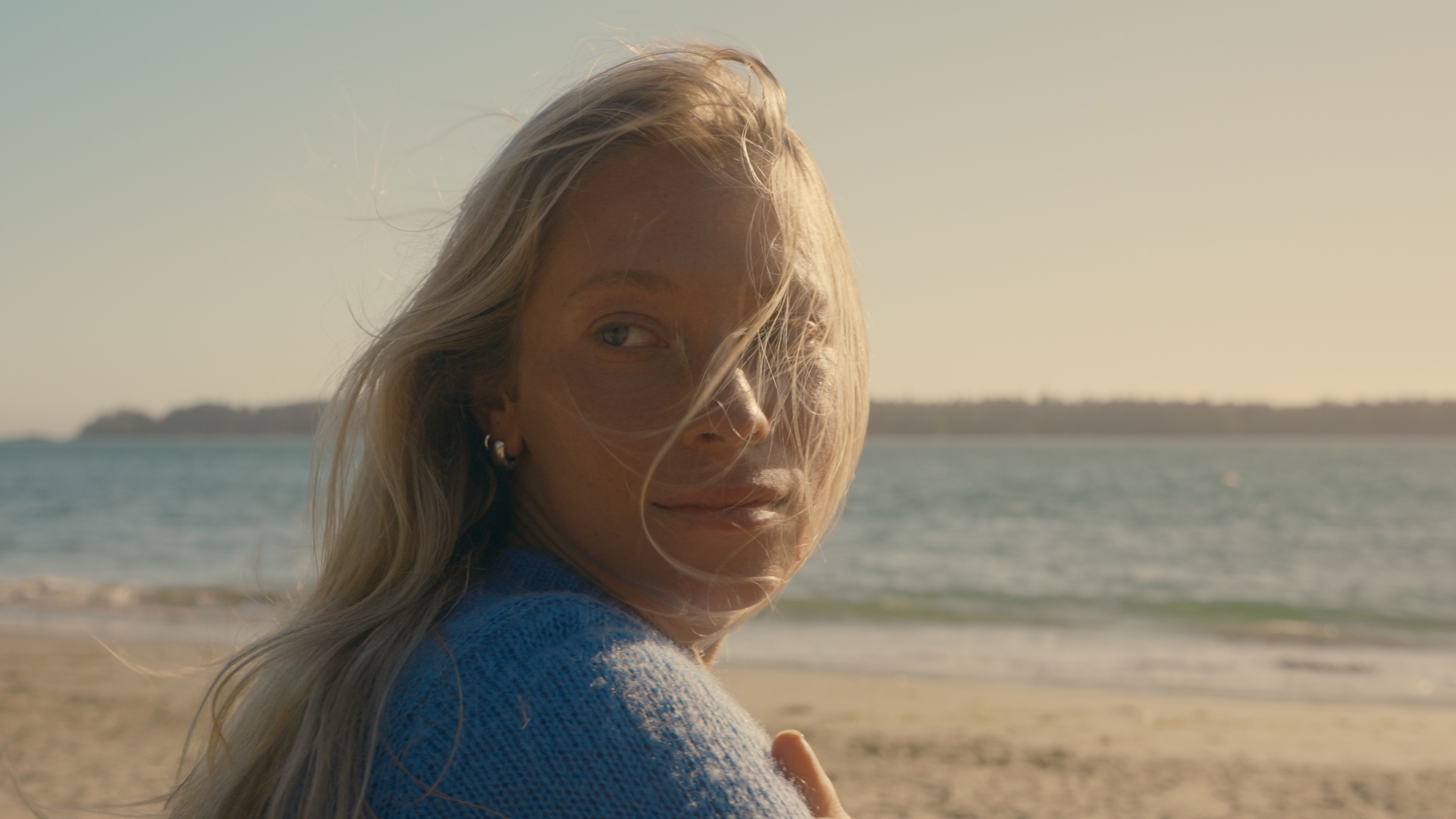 A sample image of a person with hair blowing in the wind taken with the Moment CineBloom VND