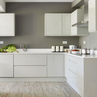 kitchen room with grey walls and kitchen cabinets