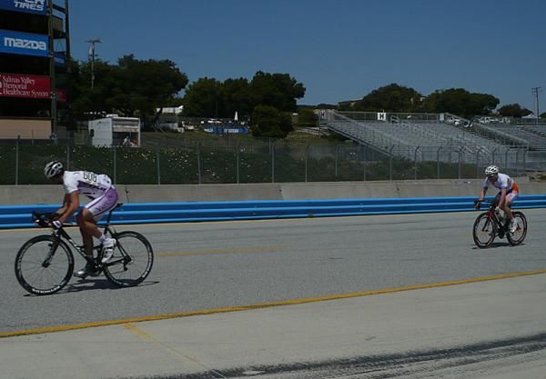 Two masters in a break away mark each other during their criterium.