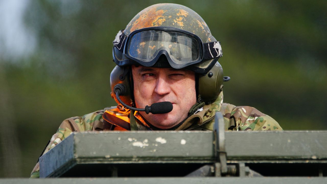 Ben Wallace rides in an Ajax armoured vehicle during a visit to Bovington Camp in Dorset 