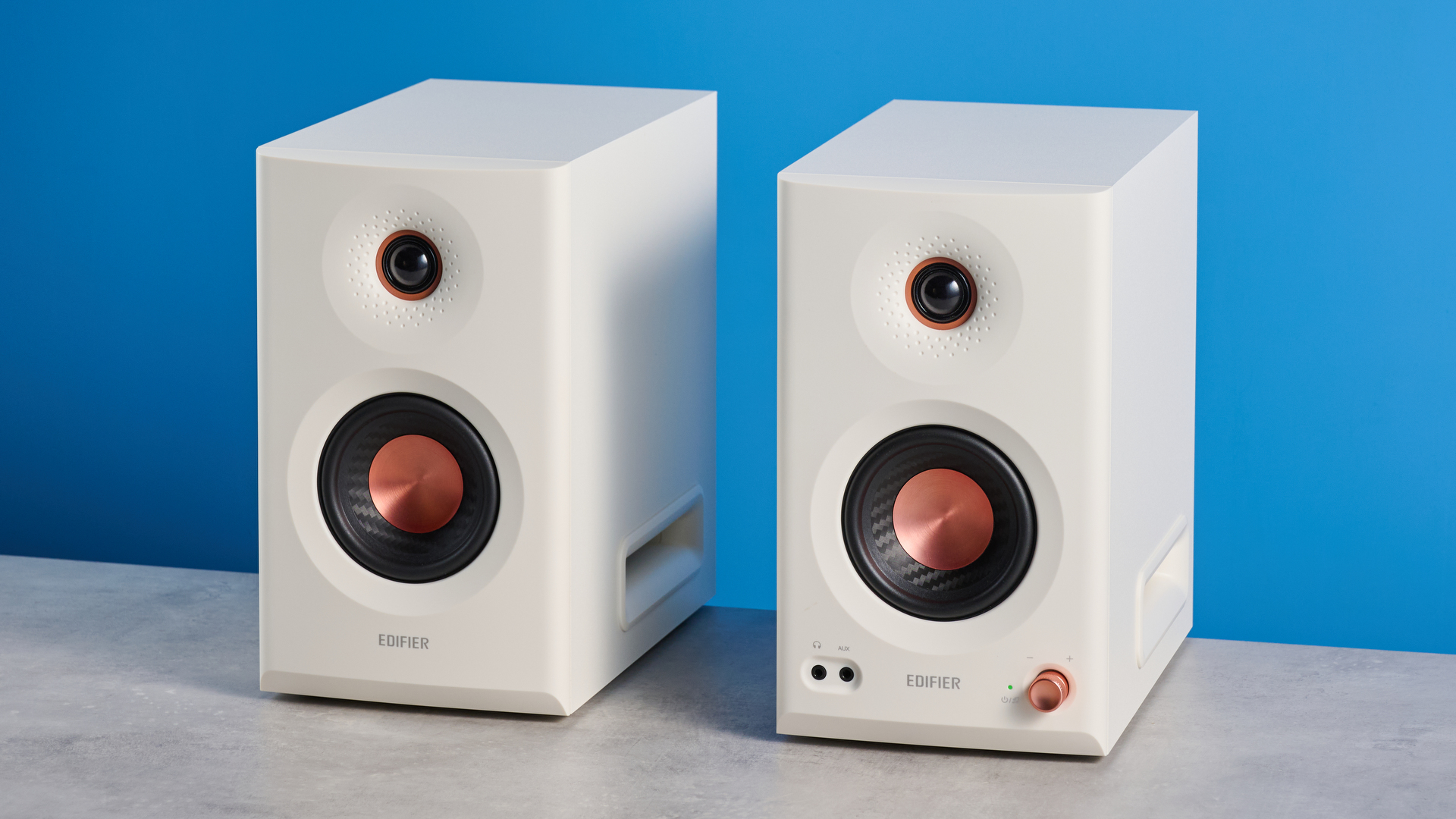 the Edifier MR5 studio monitors bookshelf speakers photographed with the blue tom's guide background