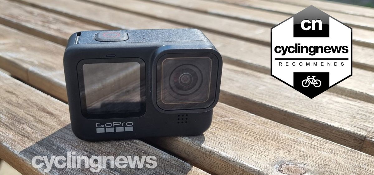 The front face of the GoPro Hero 9 Black on a wooden table overlaid with &#039;recommends&#039; badge