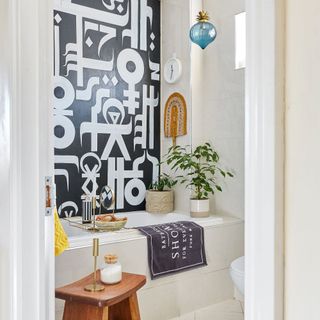 White bathroom with hand-painted black and white mural