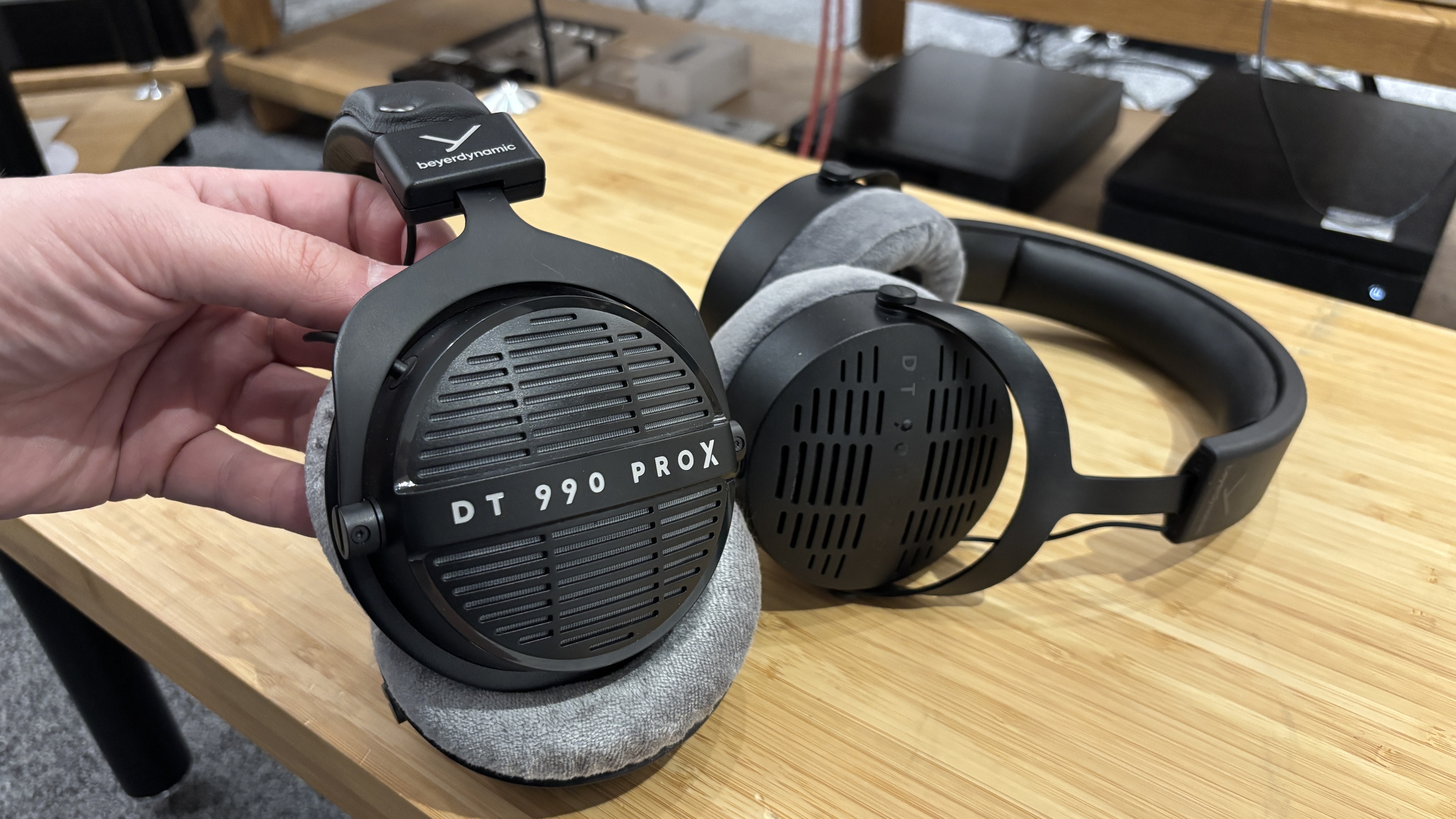 Beyerdynamic DT 990 Pro X next to the Beyerdynamic DT 900 Pro X on a rack