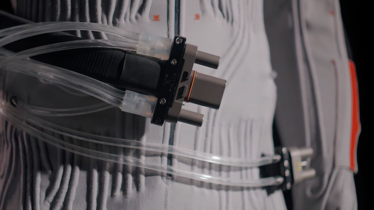 A close up of liquid cooling tubes running through an Axiom spacesuit undergarment.