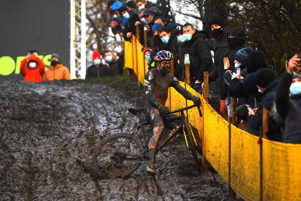 BOOM BELGIUM DECEMBER 04 Wout Van Aert of Belgium and Team Jumbo Visma falls on a muddy sector during the 7th Superprestige Cyclocross Boom 2021 Mens Elite SPBoom Superprestige2022 on December 04 2021 in Boom Belgium Photo by Luc ClaessenGetty Images