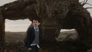 The Monster protects a young boy in A Monster Calls