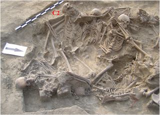 This pit contained 26 skeletons, including the remains of individual C2, whose face was digitally re-created.
