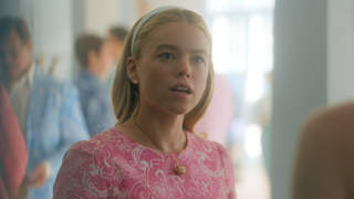 Milly Alcock looking shocked in pink dress in Sirens