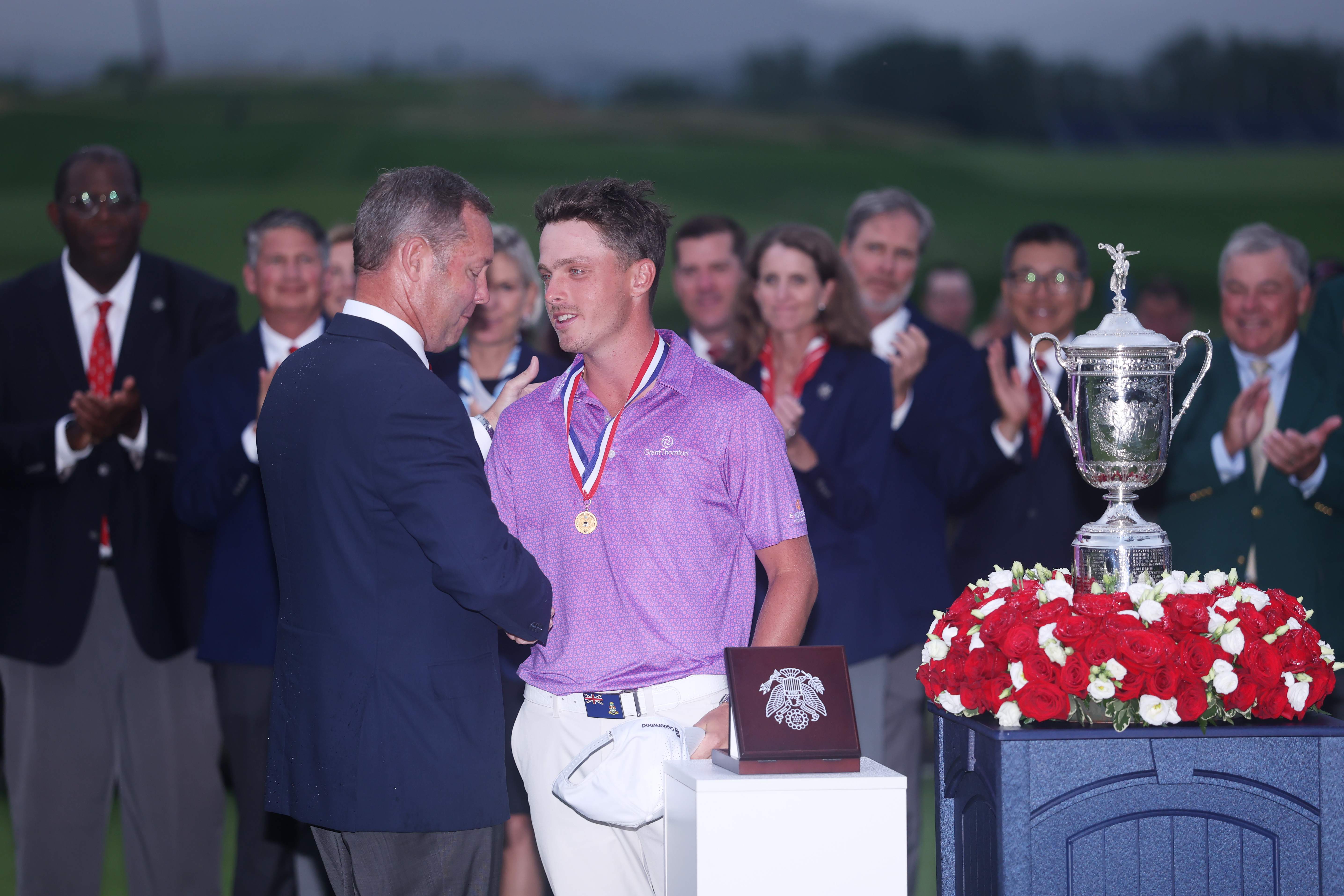 Justin Hastings (right) is congratulated by USGA CEO, Mike Whan after earning Low Am honors at the 2025 US Open