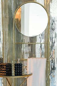 10. Luxe Towel Rack with Round Mirror: View at Amara