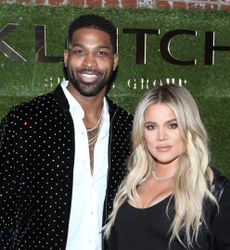 Tristan Thompson in a white shirt and black embellished jacket and Khloe Kardashian in black dress and black coat attend the Klutch Sports Group "More Than A Game" Dinner Presented by Remy Martin at Beauty & Essex on February 17, 2018 in Los Angeles, California