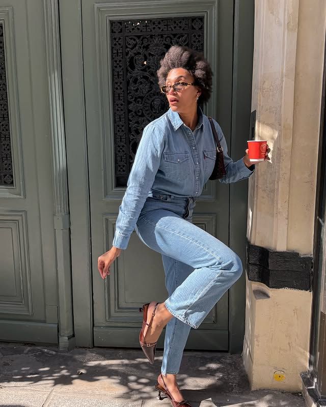 @lenafarl wears blue straight-leg jeans with a blue denim shirt and burgundy slingbacks