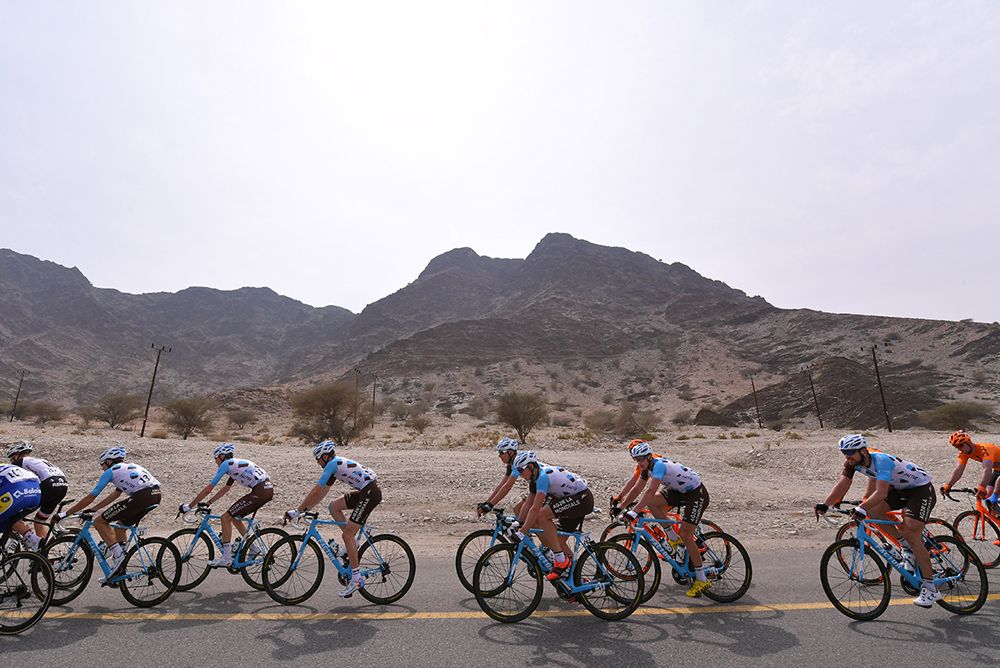 The peloton roll through on stage 3 of the Tour of Oman