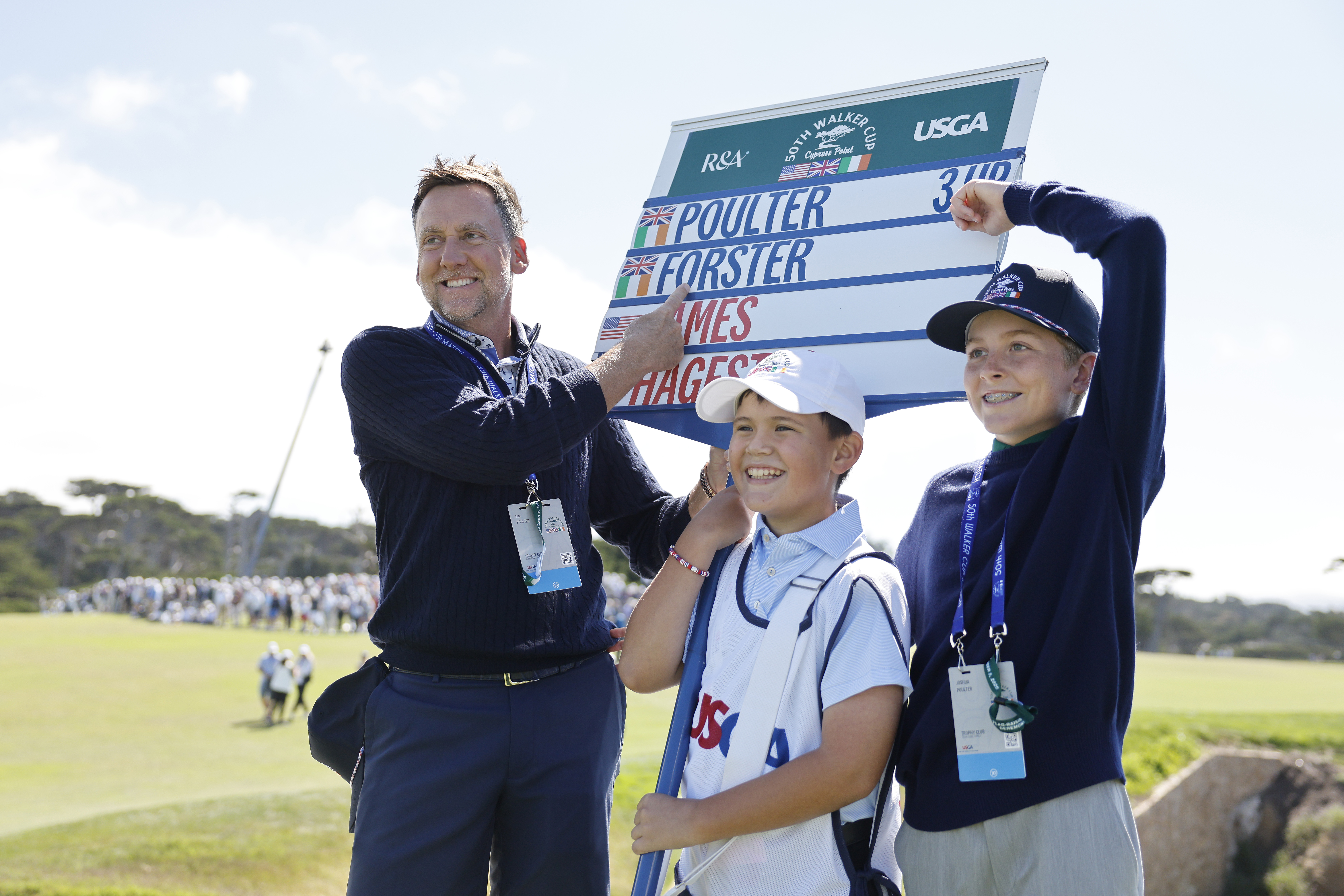 Ian Poulter and his family point at a scoreboard with his son Luke&#039;s name on it