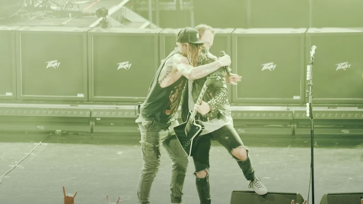 Matt Heafy hugging Matt Tuck