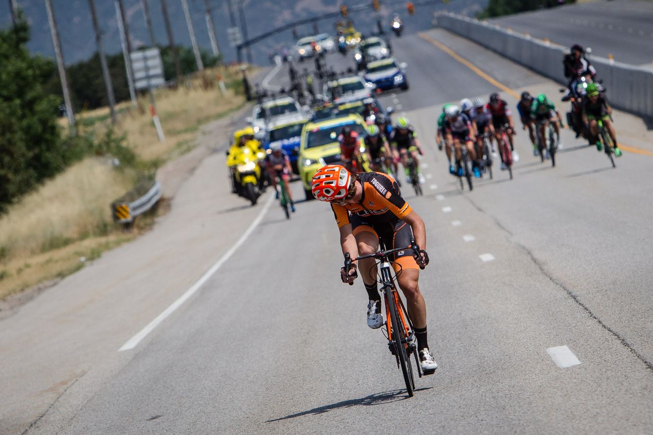 A Silber Pro Cycling rider attacks the lead group