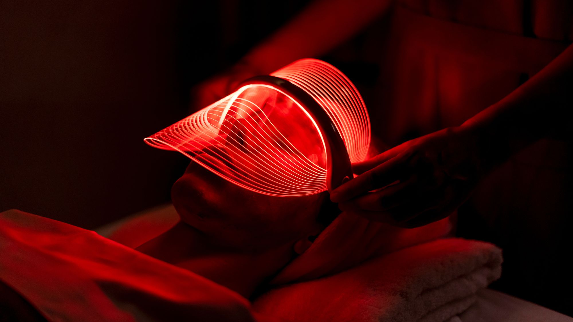 a woman wearing one of the best led face masks