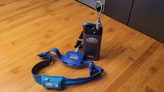 Review photo of the Celestron Elements FireCel Mega 6 charging a BioLite 425 HeadLamp