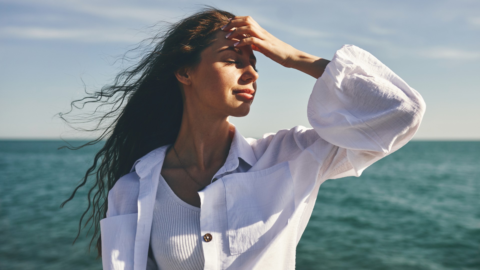 woman on the beach by the ocean