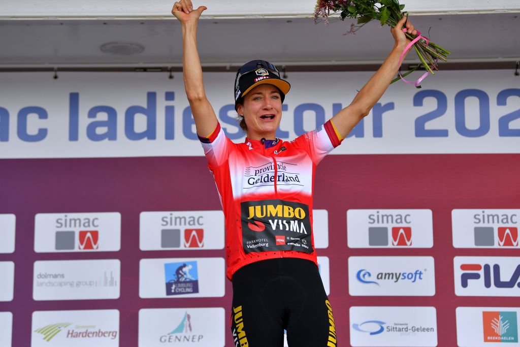 EDE NETHERLANDS AUGUST 24 Marianne Vos of Netherlands and Team Jumbo Visma celebrates winning the Red Combativity Jersey on the podium ceremony after the 23rd Simac Ladies Tour 2021 Prologue a 24km Individual Time Trial stage from Ede to Ede SLT2021 SimacDS UCIWWT on August 24 2021 in Ede Netherlands Photo by Luc ClaessenGetty Images