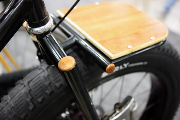 Watson Cycles used not just a wooden deck but also capped the tube ends with wooden plugs.