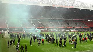 Manchester United supporters protest on the pitch at Old Trafford, May 2 2021
