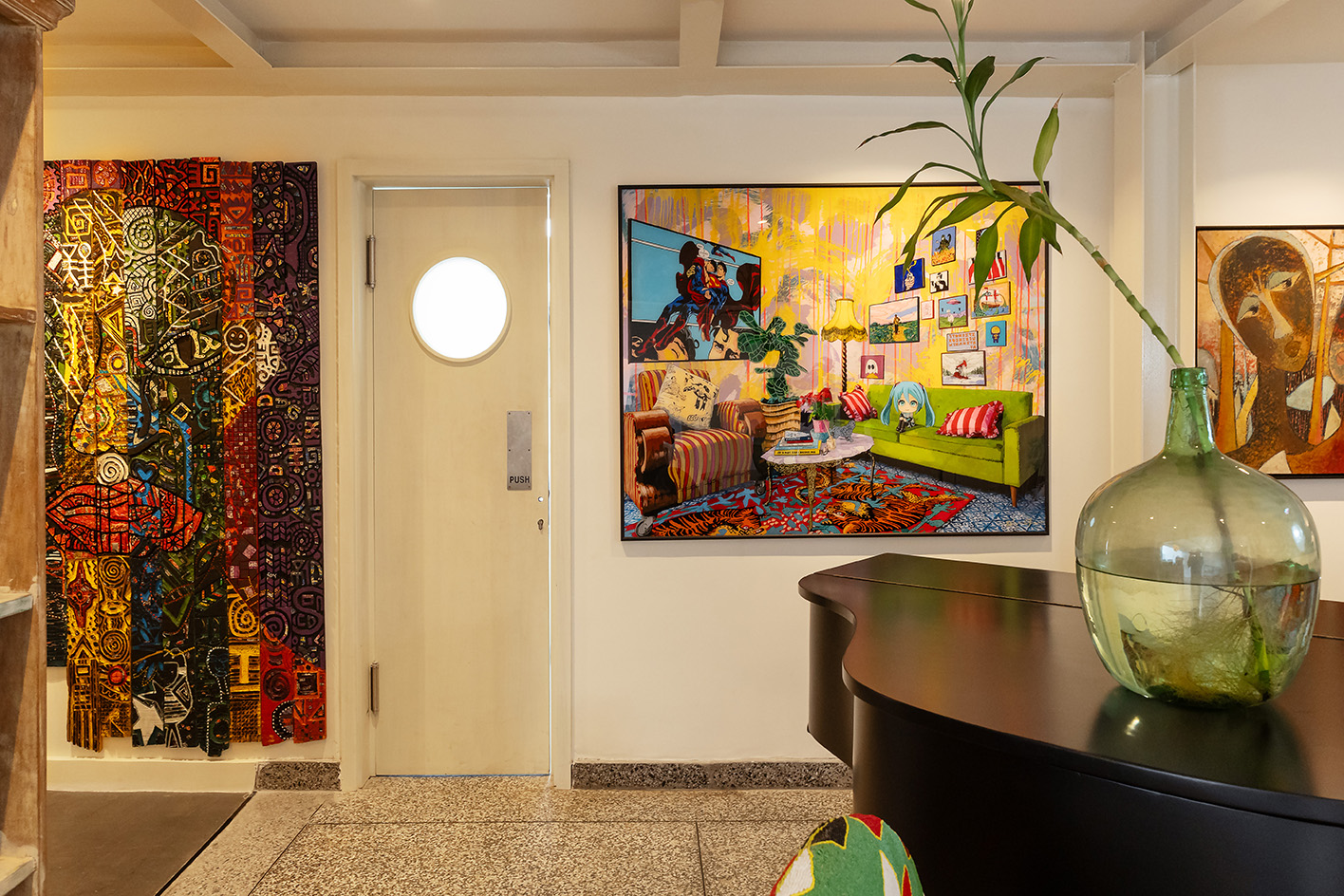 interiors at Mbari Kola, with design led furniture and art seen on walls