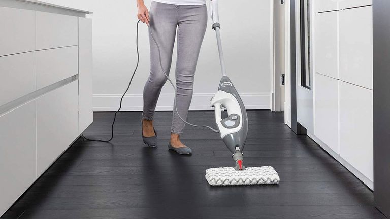woman cleaning floor with shark steam cleaner, one of our best steam cleaner picks