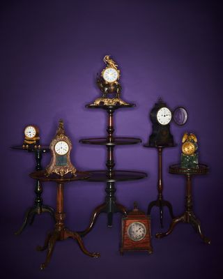 Rockefeller collection A selection of English mahogany tripod tables and French and English clocks