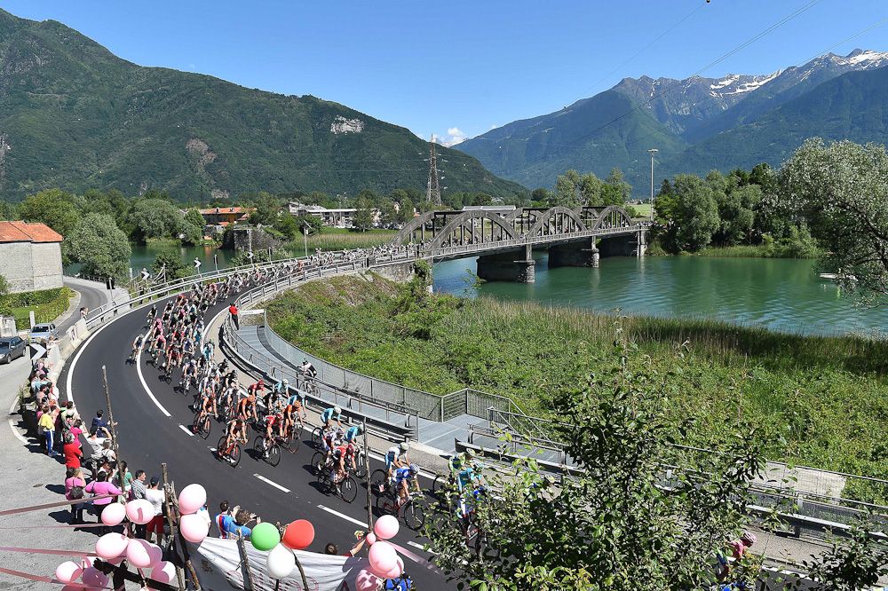 The peloton crosses a bridge during stage 17.
