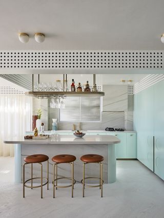 white kitchen with brass bar