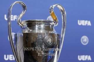 The UEFA Champions League trophy is displayed during the UEFA Champions League 2023/24 play-off round draw at the UEFA headquarters in Nyon, Switzerland, 7 August 2023.