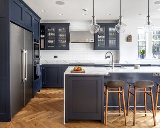 navy blue kitchen with crown molding