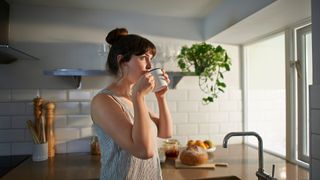 A woman relaxing in her kitchen