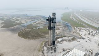 SpaceX's Starship vehicle sits fully stacked at the company's Starbase facility in South Texas in April 2023, ahead of a planned orbital test flight attempt.
